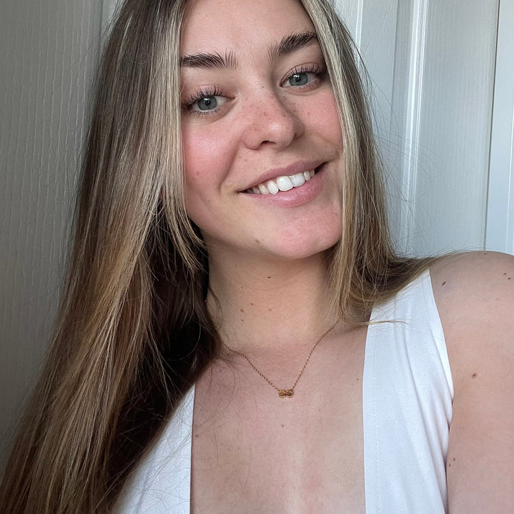 model wearing 2 initial necklace, 2 initial necklace in silver, free engraving, personalised jewellery, 2 different initial engraved on one necklace, waterproof and tarnish resistant, free gift box, 100 day warranty, personalised gift, 