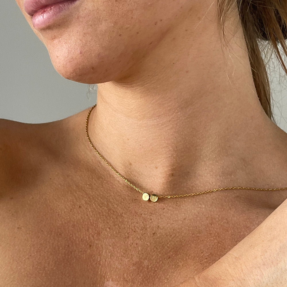 model wearing 2 initial necklace, 2 initial necklace in silver, free engraving, personalised jewellery, 2 different initial engraved on one necklace, waterproof and tarnish resistant, free gift box, 100 day warranty, personalised gift, 