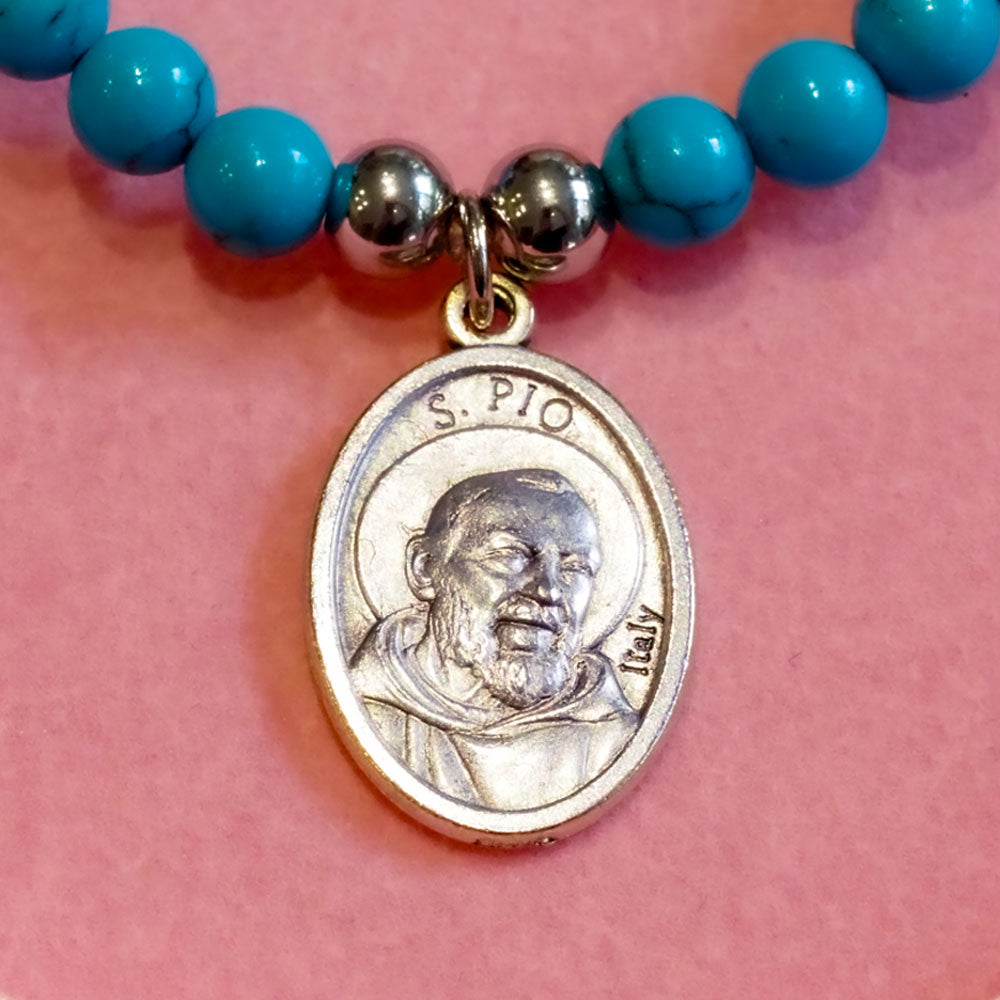 Padre Pio Saint Bracelet with natural gemstone beads and a silver saint medal, designed for spiritual protection, healing, and faith. Handmade religious bracelet with customisable stones.