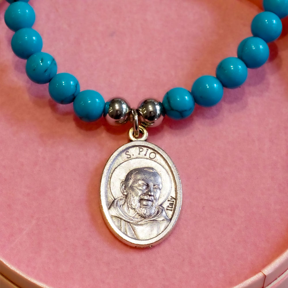 Padre Pio Saint Bracelet with natural gemstone beads and a silver saint medal, designed for spiritual protection, healing, and faith. Handmade religious bracelet with customisable stones.